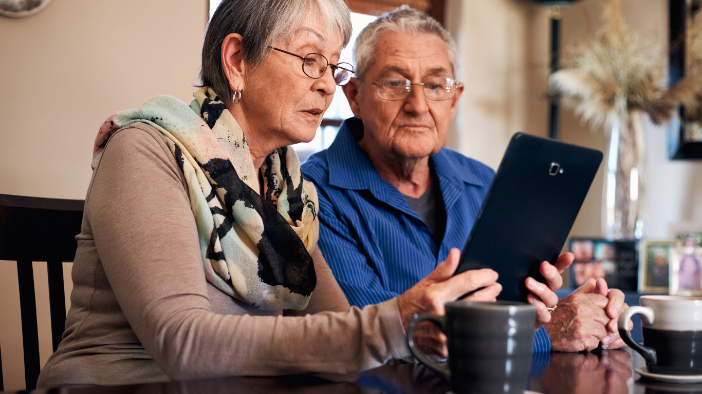 Elderly resident in a UK care home video calling family using strong data cabling connection