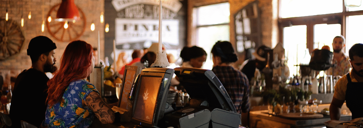Customers enjoying free Wi-Fi in modern café