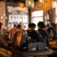 Customers enjoying free Wi-Fi in modern café
