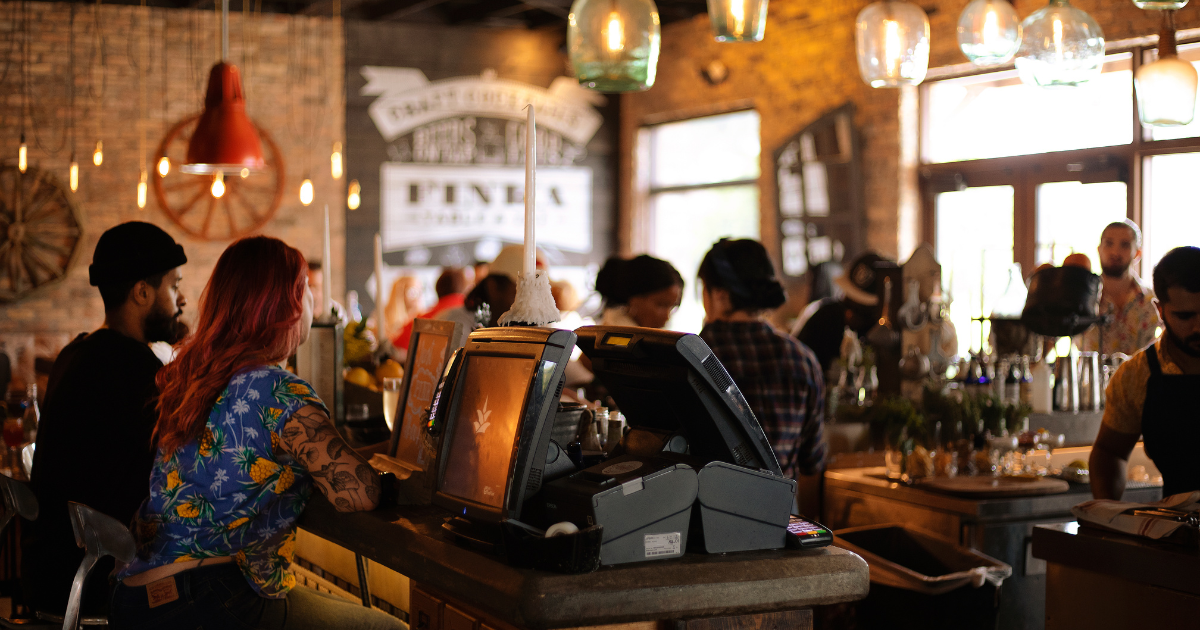 Customers enjoying free Wi-Fi in modern café