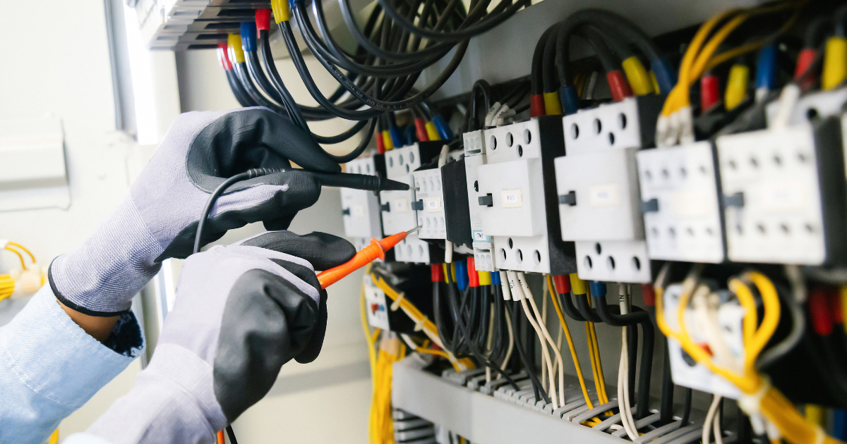 Technician testing and optimising new business network cabling
