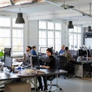 Modern office team using fast business network supported by Cat6a and Cat7 cabling.