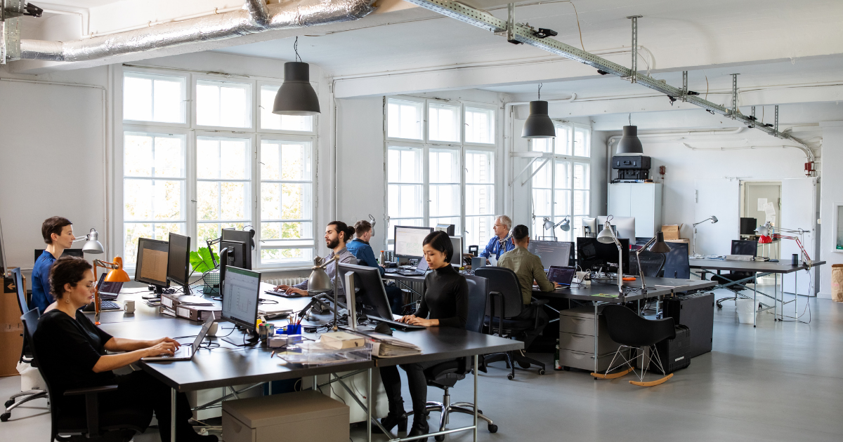 Modern office team using fast business network supported by Cat6a and Cat7 cabling.