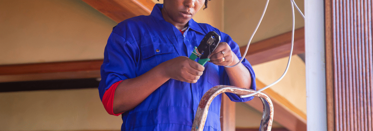 Technician comparing Cat5e and Cat6a network cables during upgrade consultation.