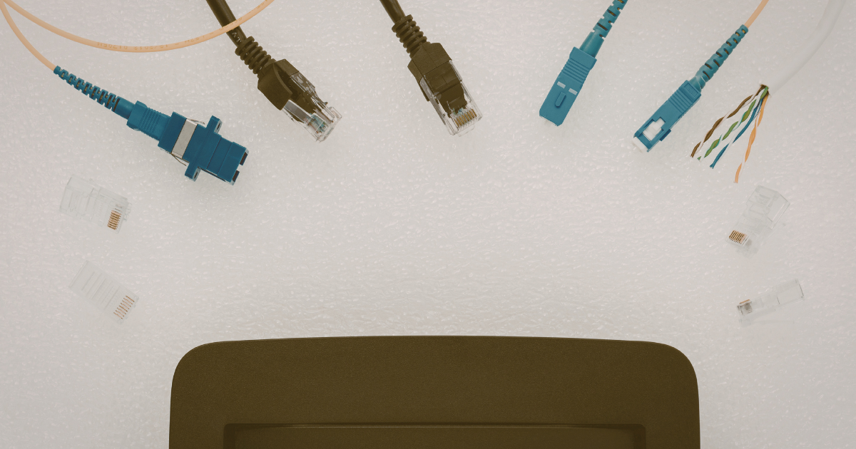 Comparison of Cat6 copper cabling and fibre optic installation in commercial network infrastructure.