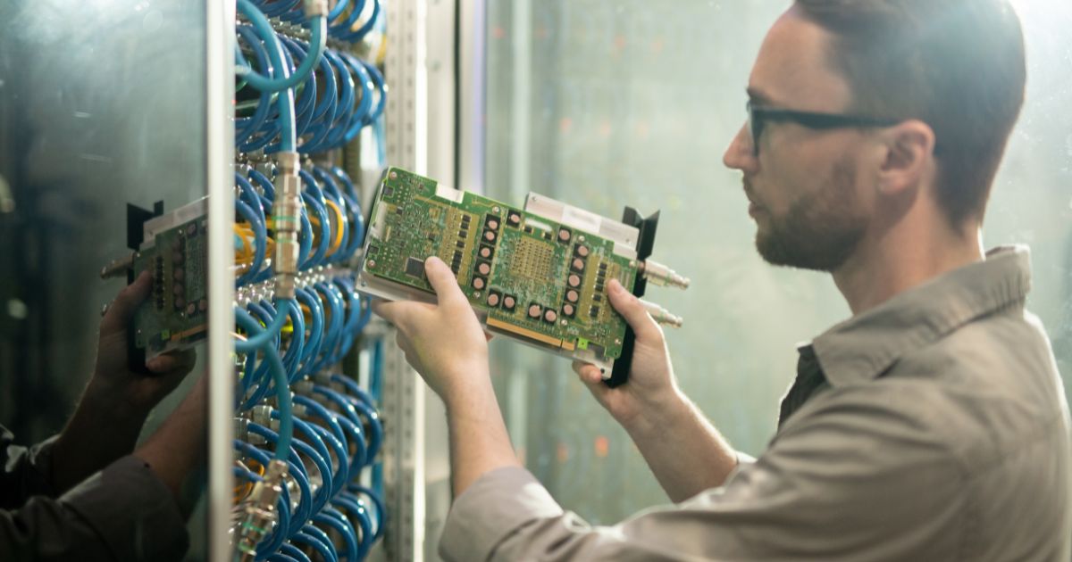 Engineer installing commercial data cabling in Birmingham