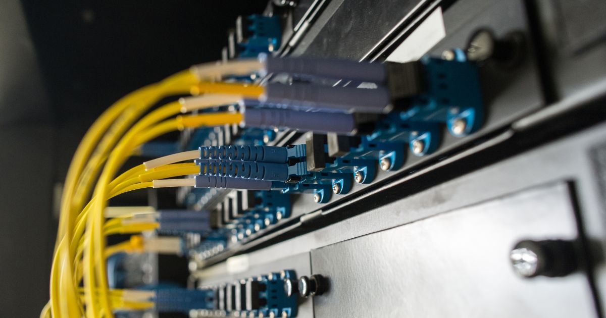 Structured cabling engineer installing commercial network infrastructure for offices, schools and industrial facilities